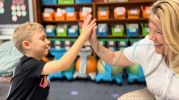 christel and boy high-five
